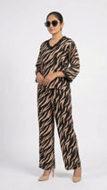 Person wearing a zebra print outfit on a white background
