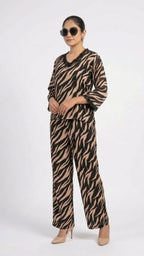 Person wearing a zebra print outfit on a white background